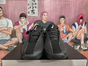 Pair of black Nike KD basketball sneakers shown from the front on a box.