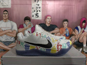 Side view showing the black Swoosh and multicolor geometric graphics on a white basketball shoe.