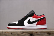 Opposite side profile of the black, white, and red low-top sneaker.