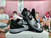 Angled view of Nike basketball sneakers showing the patterned side panels, black overlays, gray midsole, and visible Nike Zoom marking.