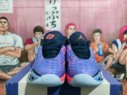 Front view of the shoes showing the patterned uppers and tongue logos