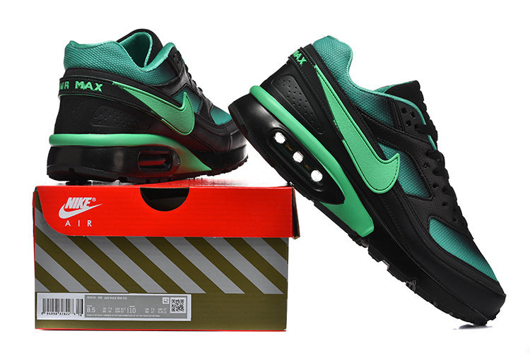 Black and mint-green Nike Air Max sneaker shown beside a Nike Air box.