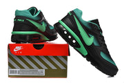 Black and mint-green Nike Air Max sneaker shown beside a Nike Air box.
