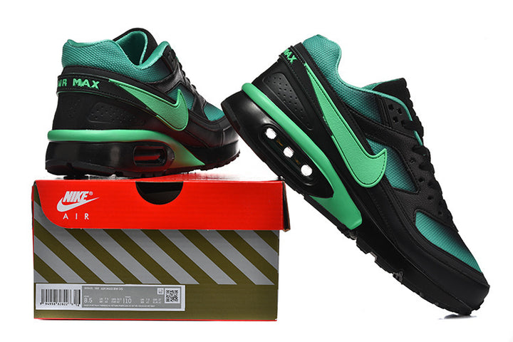 Black and mint-green Nike Air Max sneaker shown beside a Nike Air box.