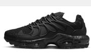 Side profile of a black Nike Air Max Plus TN-style sneaker.