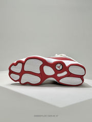 Underside view of the white and red Jordan sneaker showing the segmented outsole and Jordan logo.