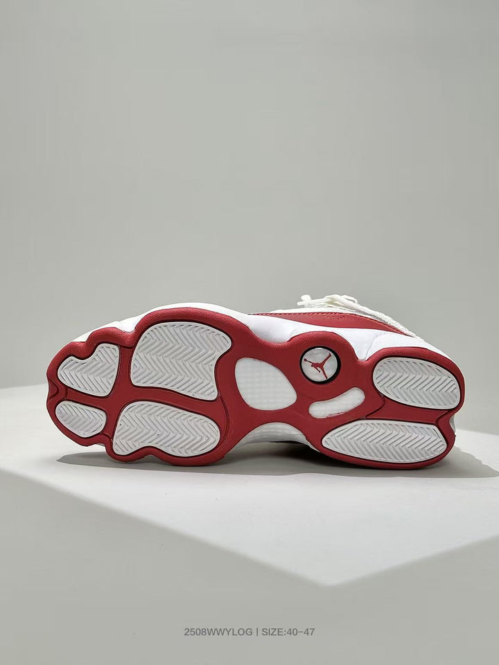 Underside view of the white and red Jordan sneaker showing the segmented outsole and Jordan logo.