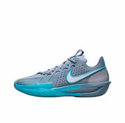 Side view of a gray Nike GT Cut 3 sneaker with bright turquoise Swoosh and outsole accents.