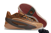 Brown sneaker shown beside an upturned shoe displaying the burgundy and dark zigzag outsole.