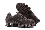 Dark brown Nike Shox TL sneakers shown from the side and outsole.