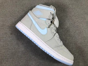Side view of one gray high-top sneaker with a pale blue Swoosh, ankle panel, white midsole, and blue outsole edge.