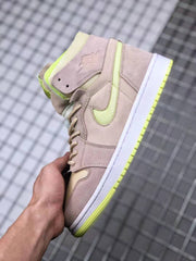 Close-up side view of a beige and neon yellow-green high-top sneaker with layered panels, Swoosh branding, and a white midsole.
