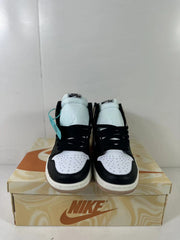 Front view showing the white perforated toe boxes, black overlays, black laces, and padded tongues.