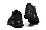 Rear and outsole views of black Nike Pegasus Premium shoes.