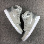 Pair of grey and silver high-top sneakers arranged diagonally, showing both lateral sides.