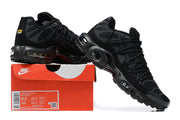 Black Nike Air Max Plus sneakers displayed with a box showing EU 42