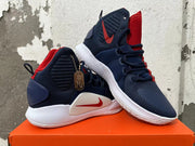 Pair of navy, red and white Nike high-top basketball shoes shown at an angle