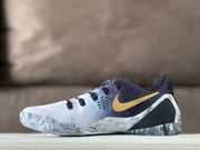 Opposite side view showing the white upper, dark collar, gold Swoosh, and marbled sole detailing.