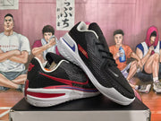 Pair of black basketball shoes with pink, red, blue, and white accent details shown from side and top angles.