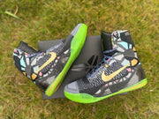 Nike Kobe 9 All-Star shoes arranged on a box, showing side panels and lime-green outsoles