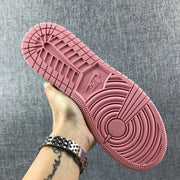 Close view of the pink rubber outsole with its circular and traction patterns.