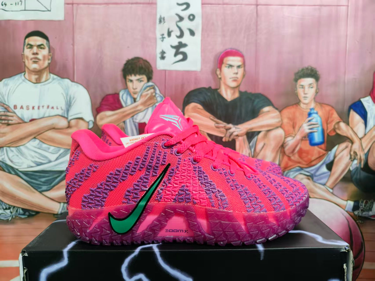 Side view of pink and purple Nike sneakers showing the textured upper, green-and-black swoosh, and translucent purple outsole.