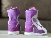 Rear view highlighting the purple padded collars and heel sections.