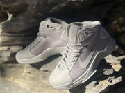 Top-front angled view showing the laces, padded tongue, perforated toe area, and side Swoosh.