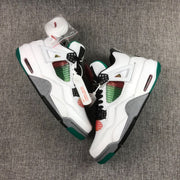 Top-down view showing both sneakers, white spare laces, multicolor mesh panels, and contrasting green and grey details.