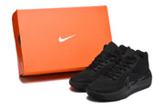 Black Nike sneakers displayed beside an orange Nike shoebox.