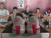 Rear view of the pair showing GT branding, pink heel details, and textured side panels.
