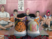 Rear view showing the patterned heel panels, padded collars, white midsoles, and textured outsoles.