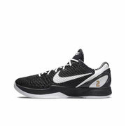 Black and white Kobe 6 sneaker with white laces, a white Swoosh, and a gold number 2 heel detail.