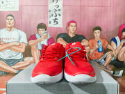 Front view of red Nike basketball sneakers with white midsoles and red laces.