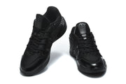 Pair of black Nike 518-6 basketball-style sneakers shown from the front and three-quarter angle.