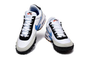 Front and top view of white and blue Nike Air Max Plus sneakers with Nike Air tongue branding.