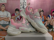 Angled product view showing both pink and light grey Adidas sneakers with layered uppers and contrasting soles.