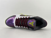 Top view of the shoe highlighting the purple toe and tongue logo.