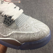 Close-up of the graphic-patterned toe box, gray lace hardware, and translucent blue outsole.