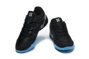 Pair of black basketball shoes with silver Swooshes and bright blue outsole accents, shown from the front
