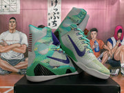 Pair of gray, green, and purple high-top basketball shoes