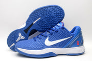 Blue basketball sneakers shown from the side and outsole, displaying the patterned traction surface and Kobe logo.