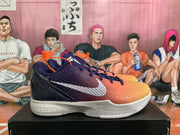 Side view showing the orange-to-purple upper, white side branding, and Zoom-marked midsole.