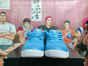 Front view of royal blue Nike basketball sneakers showing the laces, padded tongues, and white toe outsoles.
