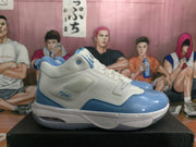 Side profile of a white and blue basketball sneaker with visible “Flight” text and a heel window.