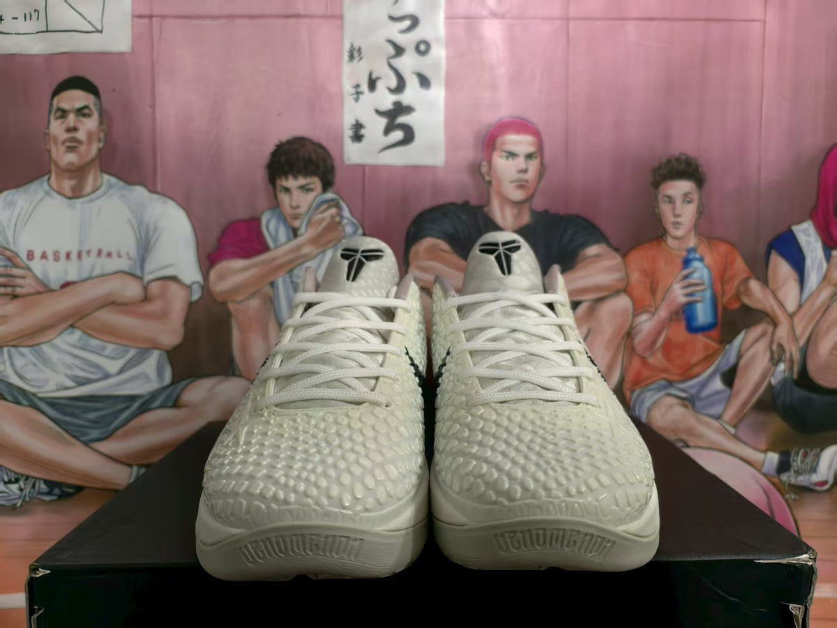 Front view of cream Nike All-Star 2.0 sneakers with white laces, black tongue logos, and textured toe panels.