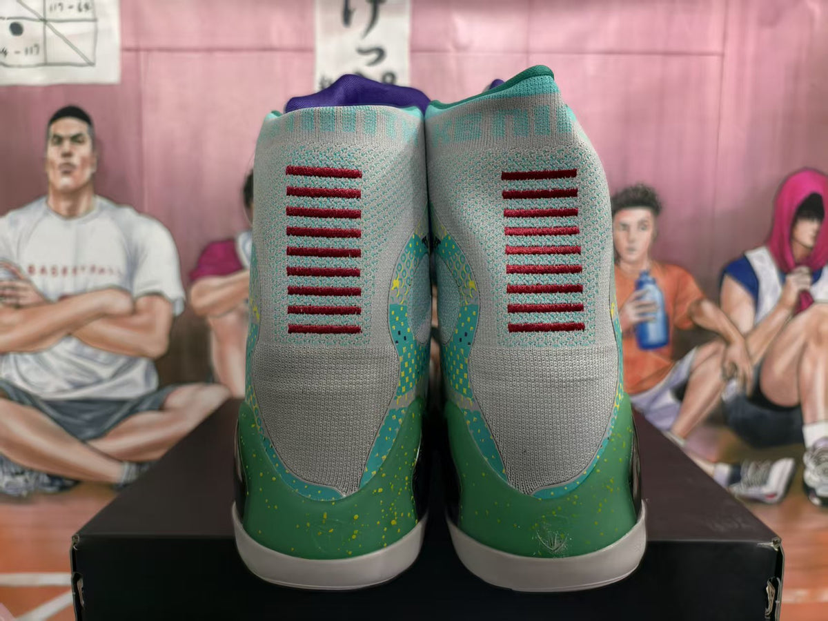 Rear view of green and gray high-top basketball sneakers with turquoise details and purple accents.