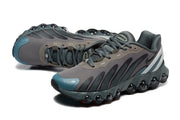 Pair of grey and teal Nike Air Max DN8 sneakers viewed from above and the side.