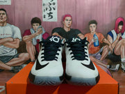 Front view of the white basketball shoes with black laces and Swoosh detailing.