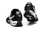 Rear and outsole views of black Nike sneakers with white Swoosh panels and visible cushioning.
